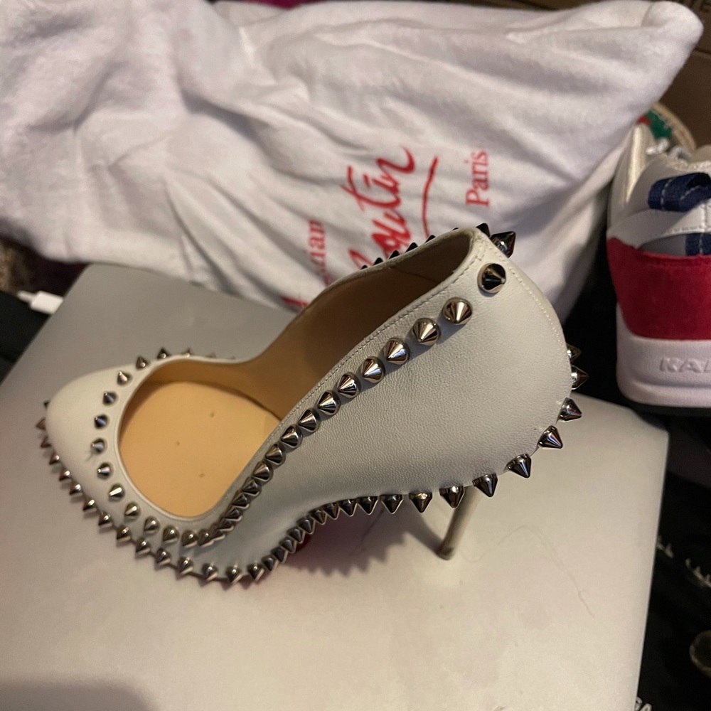 White Christian louboutin pumps